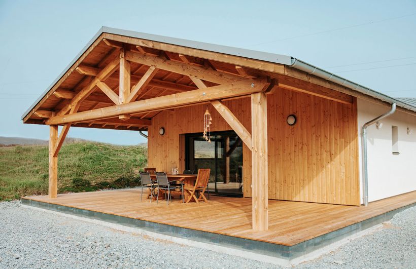 Vue 3/4 gauche avant terrasse maison ossature bois
